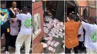 Friends storm man's house as he graduates, spray their whole compound with money in viral video