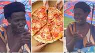 I go chop am: Excited old woman jumps on pizza in video, says she has not tasted it before