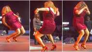 Woman in short red gown and heels dances softly on stage, makes people salivate and scream, video goes viral
