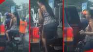 Lady comes down from okada, quickly jumps inside Land Cruiser, big man pays her fare