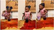 Is this necessary? Reactions as kid pours juice away while learning to fill a cup, mum watches her in video