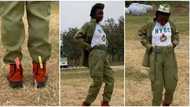 "N3,500 to slim-fit": Lady who got oversized khaki in NYSC camp uses clips to hold the waist, video goes viral