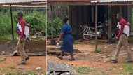 "All I see is love": Nigerian man backs his baby while walking with wife on the road, video causes buzz