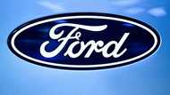 Hefty electric vehicle costs dent Ford profits