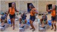 "You no go chop inside": Lady on braids dances beside mother preparing hot amala, many react to her attitude