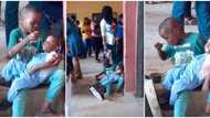 Nigerian boy licks spoon like a mother in video & feeds his crying little sister in school while mum took quiz