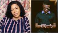 Actress Toyin Abraham star struck after running into Wizkid at an event, showers him with kisses on the cheek (video)