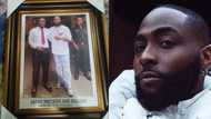 "My children will see it": Young man who snapped picture with Davido frames the image, photo goes viral