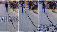 "Rapunzel": Lady with very long hair like snake walks in street as people gather to watch