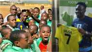 School children storm Kano Pillars training ground on seeing Ahmed Musa