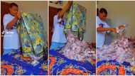 "So na you carry our money": Young man opens 'Ghana Must Go bag,' flaunts lots of cash he got on his birthday