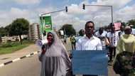 PHOTOS: Nigerians March Against Corruption Urging Buhari To Jail Ngozi Okonjo-Iweala