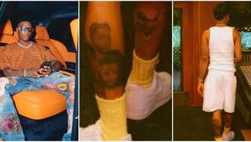 "Such a loving father": Afrobeats star Wizkid warms hearts as he tattoos faces of his 4 children on his legs