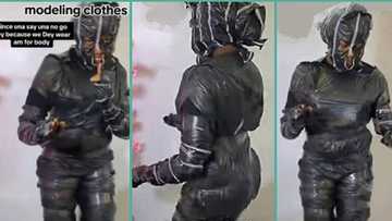 "No body contact": Okrika seller wraps herself with cellophane before modelling her clothes in video