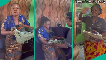 Ex-corper submits her NYSC uniform and boots to mother after service, explains why she did so