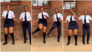 Two female students in school uniform dance outside classroom, video of accurate steps goes viral