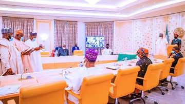 Breaking: Photos emerge as Buhari swears in new INEC commissioners