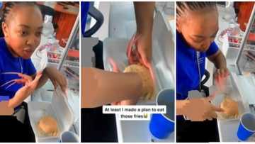 Viral video of lady with extralong nails struggling to eat burger sparks reactions