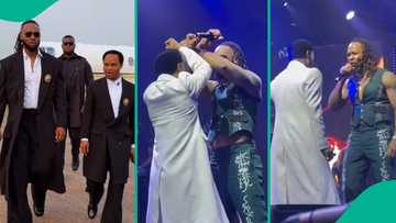 Flavour and Prophet Odumeje's unusual hand sign as they perform on stage in Lagos draws reactions