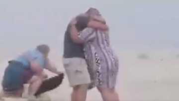 Hilarious: Beach Proposal Goes Wrong As Clumsy Photographer Trips Capturing Memorable Moment