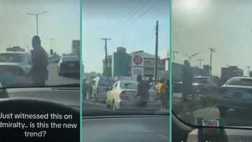 "People wey dey craze": 2 men stand in middle of road to destroy each other's cars, video trends