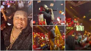 Rick Ross in Lagos: Cubana Chiefpriest makes it rain cash on American rapper, Nigerians rush to pick money
