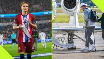 Martin Odegaard spotted on crutches as he limps onto private jet at Oslo airport