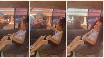 Beggar emotional and almost cried as little girl seated at the back of a car gave him cash, video goes viral