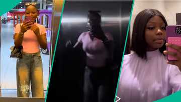 Lady enters elevator for first time, cries out as it suddenly stops and light goes off while inside