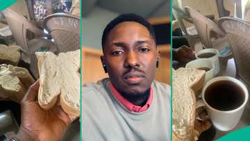 Man displays big bread and Coca-Cola he was given as holy communion at his village church