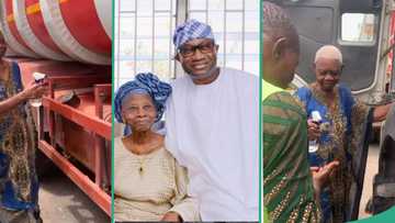 Femi Otedola’s mum sprays holy water on son’s trucks, prays for drivers: “You’ll also buy your own”