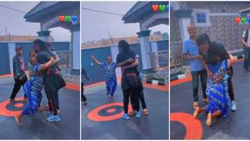 "God when": Mum hugs son tightly on her knees in cute video as he returns to Nigeria after 6 years in Europe