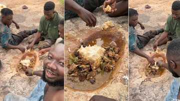 "Is this ritual or what?" Young boys dig hole inside farm, eat fufu and soup from floor, video causes stir