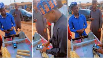 CBN policy: Sugarcane seller goes cashless, puts POS machine in his wheelbarrow as video emerges & goes viral