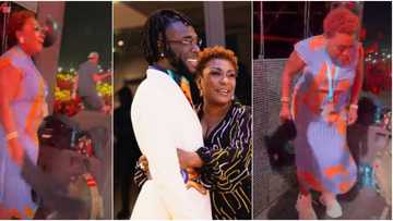"Burna Boy fit get serious girl like this?" Reactions as singer's mum drops lovely dance moves at his concert