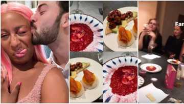 DJ Cuppy shows off her strikingly handsome Italian neighbour as she dines at his apartment with others