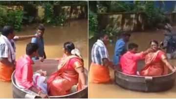 Couple float to wedding venue in giant cooking pot as flood threatens their big day, adorable photos emerge