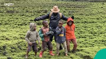 Jay Jay Okocha turns farmer? Football legend dances with kids on Rwandan farm, video