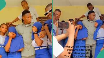 NYSC: Video shows female students shedding tears as male corper leaves their school, Nigerians react