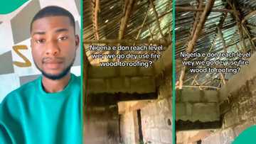 Nigerian man displays building roofed with firewood, posts video: "E don reach this level?"