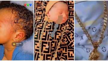 This is child abuse: Reactions to video of newborn with double piercing and huge neck chain
