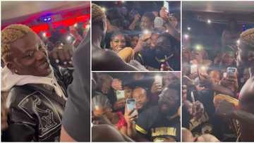 Londoners gather round Portable, scream excitedly and sing his songs word for word as he starts to perform