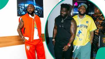 Davido helps security personnel connect with a lady at event as he assists in taking her number