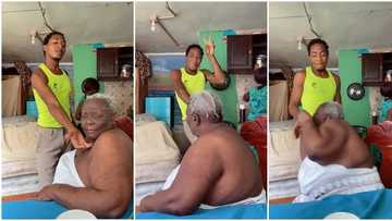 "She don change am for you": Old woman gets angry, bites man forcing her to do TikTok, video goes viral