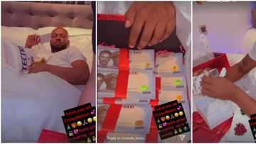 He no dey lock door? Nigerians react as Cross' fans wake him up with box of money, other gifts for Christmas