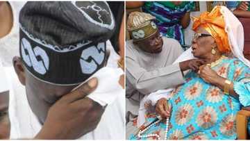 Emotional photo of President Tinubu crying after mother's death 10 years ago