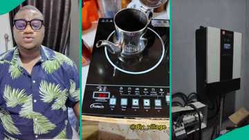 Man using solar system with lithium batteries for stable electricity powers induction cooker