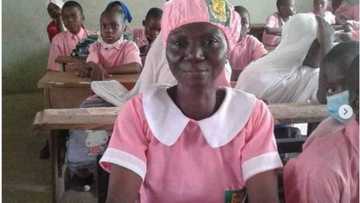 Joy as 50-year-old Nigerian woman enrolls herself in secondary school, strikes pose in school uniform