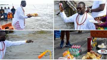 Nigerian billionaire Ayiri Emami storms river with his followers to pay homage to gods, photos spark reactions