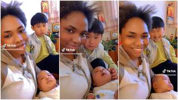 "His smile is priceless": Beautiful Nigerian lady marries Chinese man, shows off her cute oyinbo kids in video